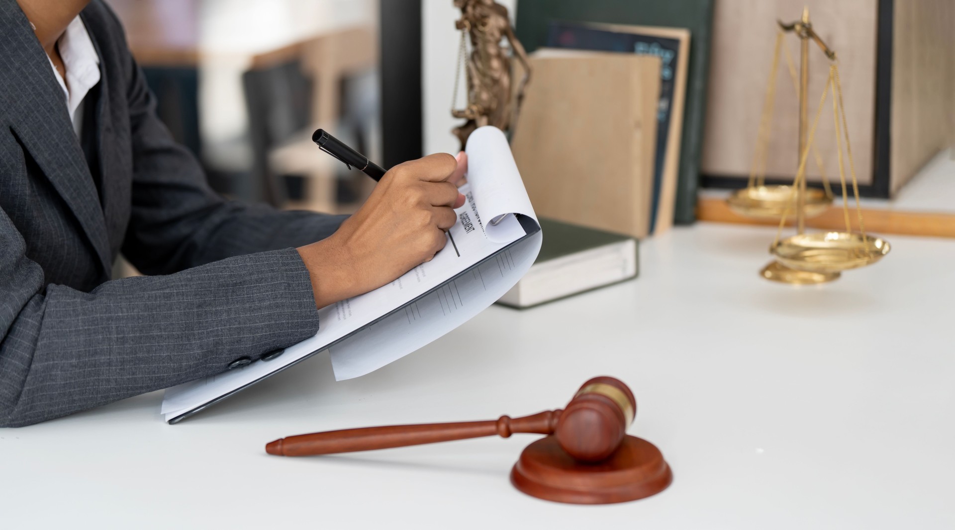 Female lawyer working in office. Law and justice concept.